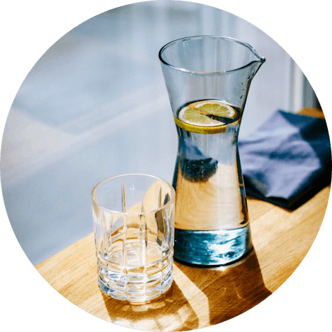 Jug of water with empty glass. 