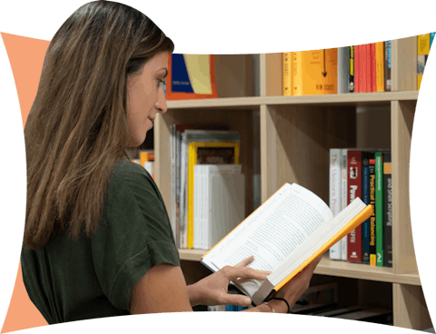 ExpressVPN employee browsing books at lending library
