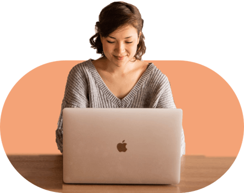 woman typing on a laptop