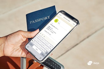 A phone showing passport details saved in ExpressVPN Keys.