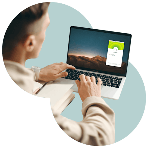 Person using a laptop with ExpressVPN.