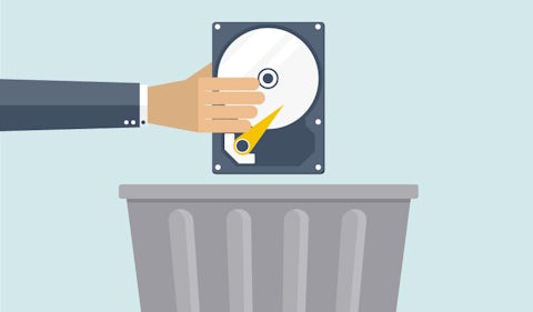 Hand holding a VPN hard drive over a trash can. Trusted Server takes hard drives out of the picture.